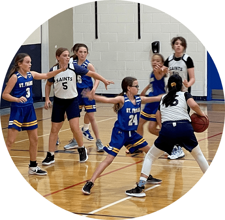 St. Francis Xavier Catholic School students playing basketball