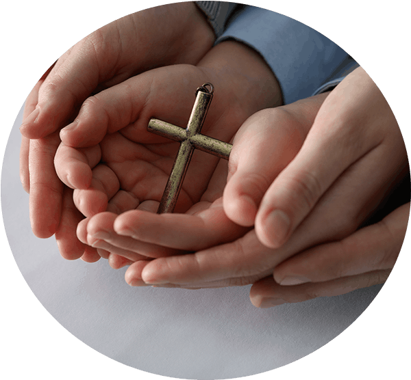 Hands holding a cross